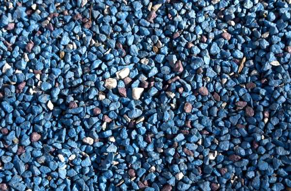 Blue painted stone pile.