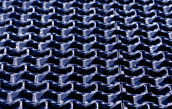 Blue plastic floor cover texture.