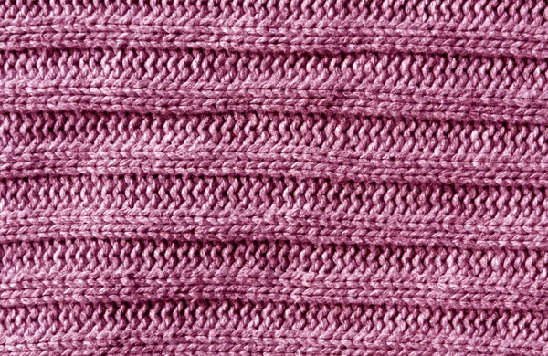 Abstract pink knitting cloth texture.