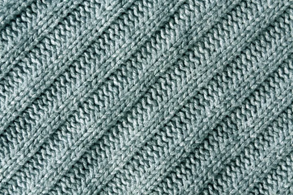 Abstract cyan knitted cloth texture.