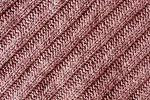 Abstract red knitted cloth texture.