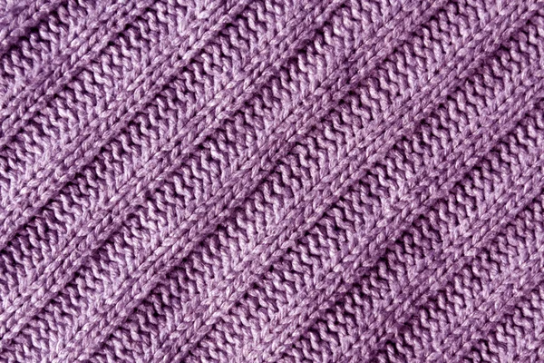 Abstract violet knitted cloth texture.
