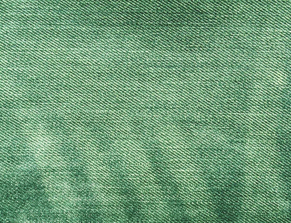 Abstract green color jeans texture.