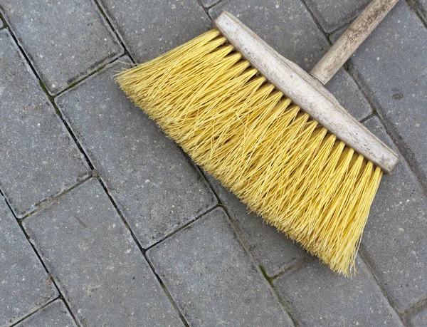 House and street cleaning yellow brush.