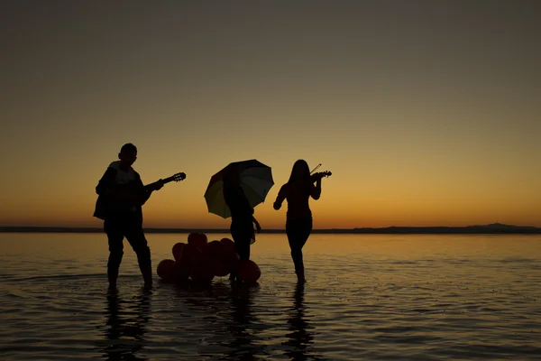 Turkey, musicians Salt lake at sunset