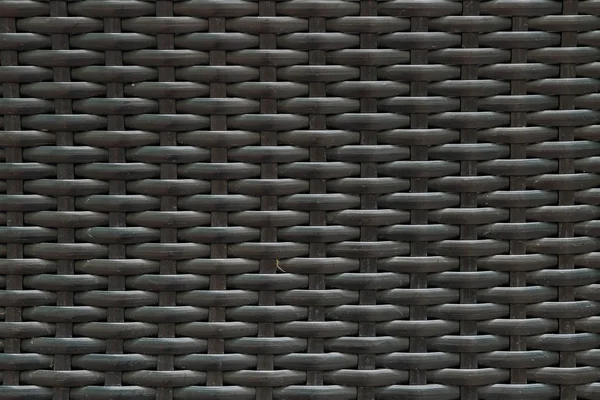 Closeup surface wood pattern at black painted wood weave chair texture background