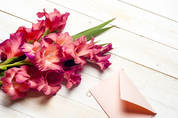 Colorful flowers in envelope, flower delivery concept. congratulate.