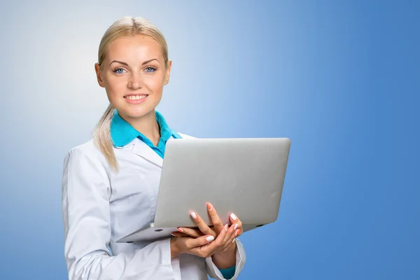 Smiling doctor woman in medical gown