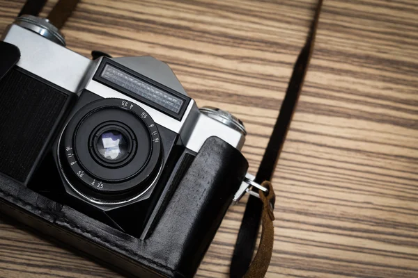 Vintage camera on wooden table