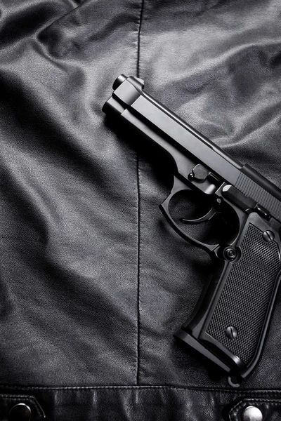 Gun on leather jacket