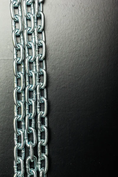 Chain parts on black background