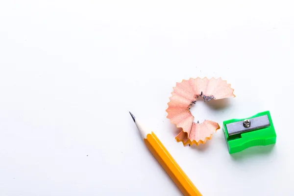 Yellow pencil and green pencil sharpener