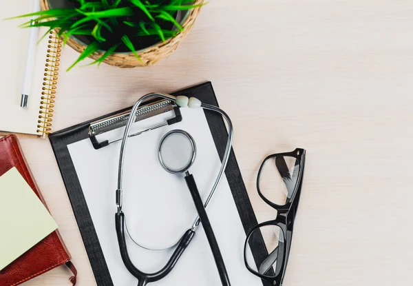 Medical clipboard and stethoscope.