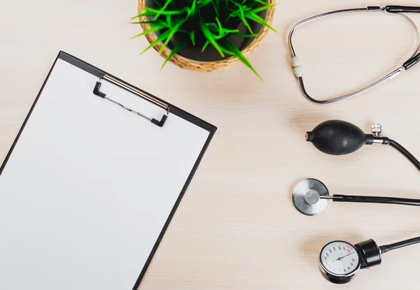 Medical clipboard and stethoscope.