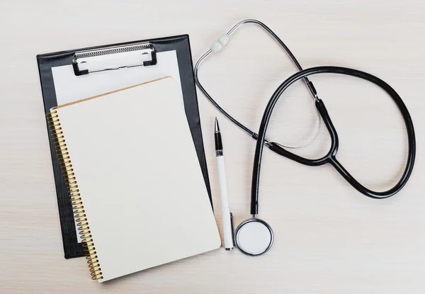 Medical clipboard and stethoscope.