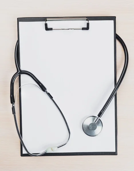 Medical clipboard and stethoscope.