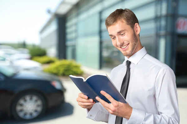 Business man reading a book