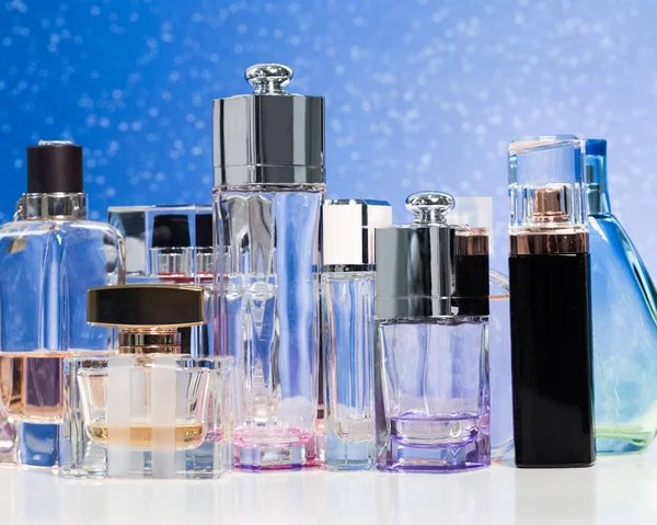 Various bottles of woman perfume