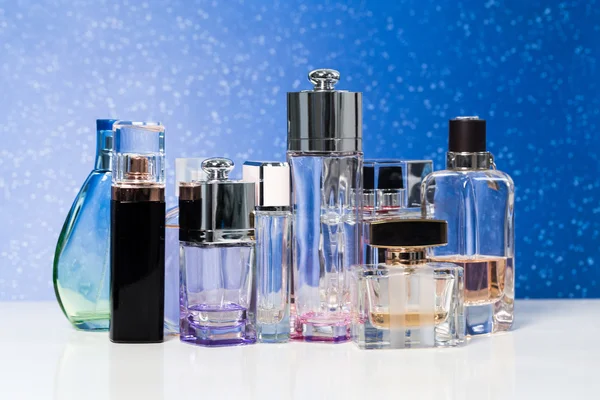 Various bottles of woman perfume