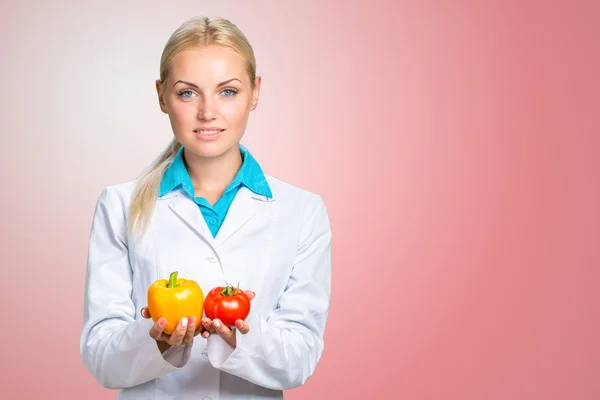 Happy Female Dietician With Fresh Vegetables