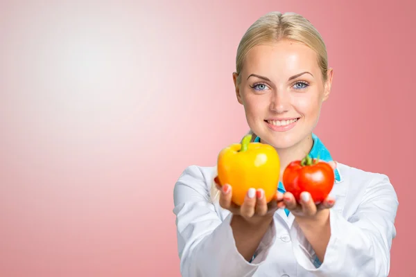 Happy Female Dietician With Fresh Vegetables