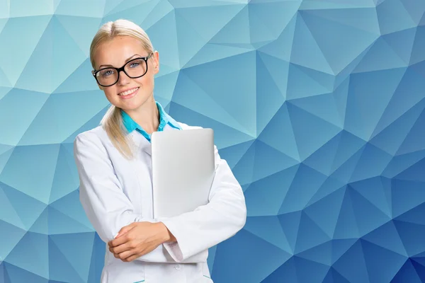 Smiling doctor woman in medical gown