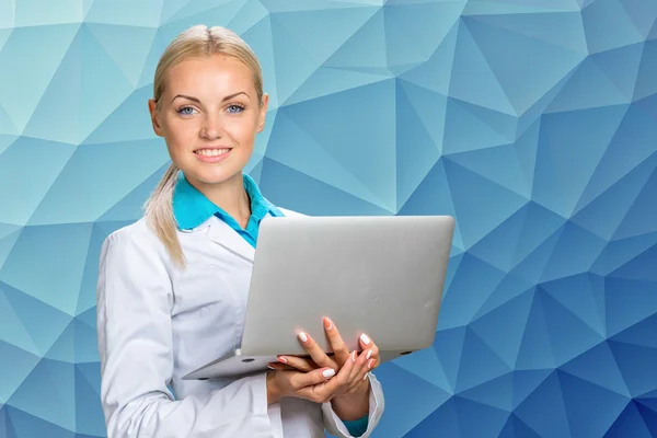 Smiling doctor woman in medical gown