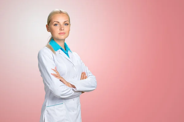 Smiling doctor woman in medical gown