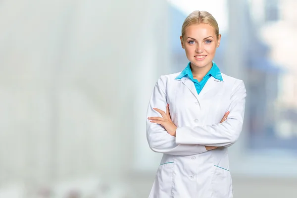 Smiling blonde doctor woman