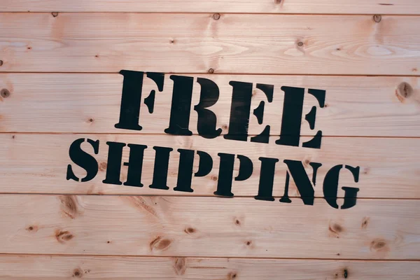 Free Shipping. Free Shipping word on wooden transport box. Free Shipping Package.