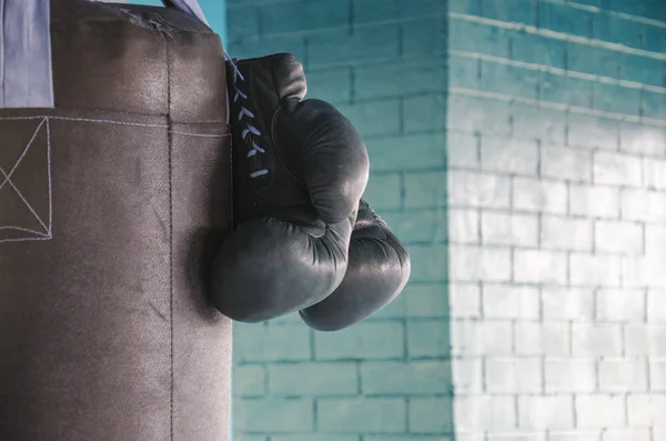 Boxing gloves on a punching  bag in the gym