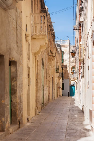 Empty streets of Rabat in the early morning. Ancient narrow streets with old fashioned balconies, cafes, little shops and hotels. Malta.