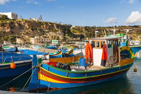Port of Mgarr on the small island of Gozo, Malta. Traditional maltese colorful painted fishing boat.
