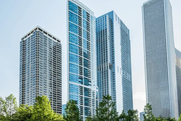 Downtown residential skyscrapers in Lake Shore East Park with green trees of Chicago, USA