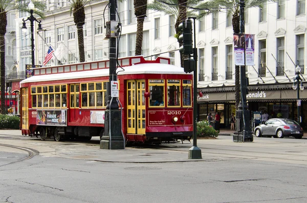 A Canal Street line streetcar rides in the downtown of New Orleans, Louisiana.