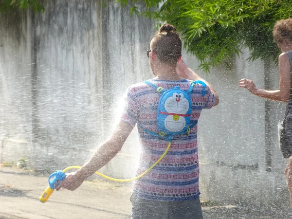 Man having fun with water gun