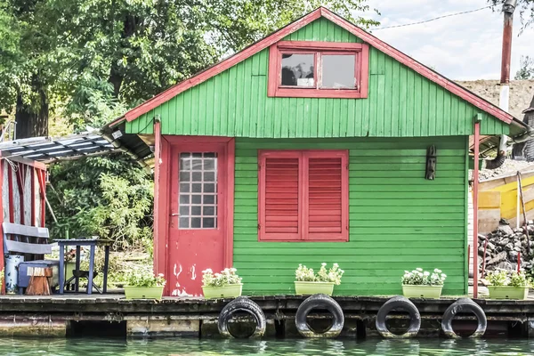 Old Wooden Green-Red Raft Hut On Sava River