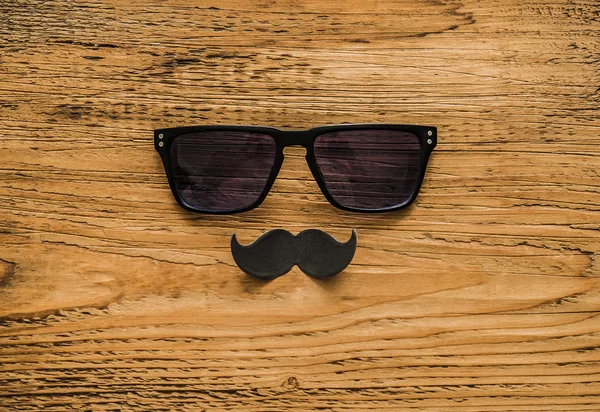 Glasses and black paper mustache