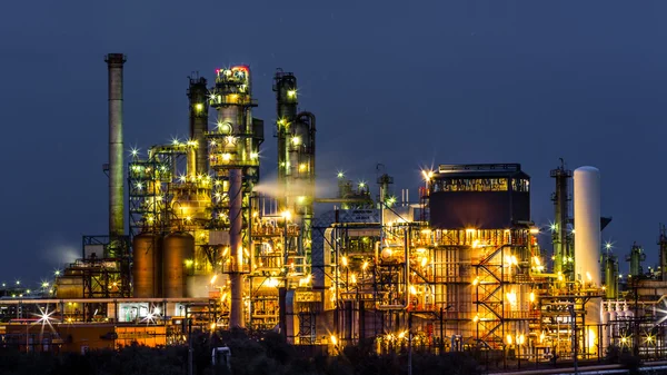 An illuminated oil and gas refinery plant