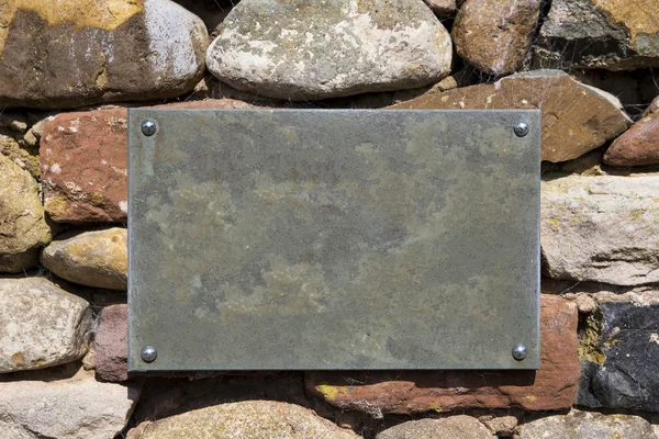 Blank Slate Sign on Stone Wall