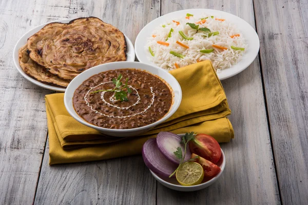 Dal Makhani or daal makhni or Daal makhani, indian lunch/dinner item served with plain rice and butter Roti, Chapati, Paratha and salad