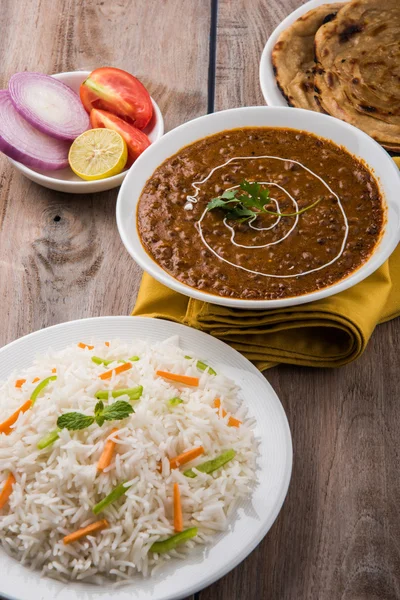 Dal Makhani or daal makhni or Daal makhani, indian lunch/dinner item served with plain rice and butter Roti, Chapati, Paratha and salad