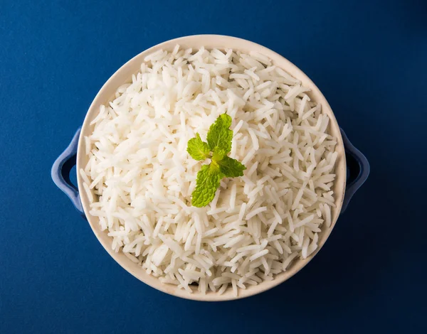 Basmati rice in a brass bowl, cooked basmati rice, cooked plain rice, cooked white basmati rice, steamed basmati rice