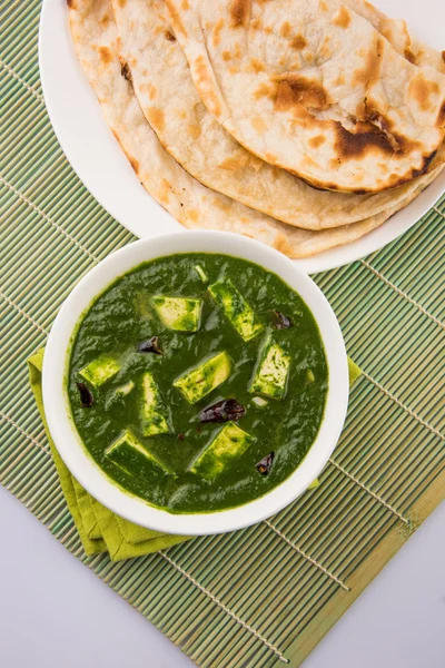 Palak paneer with indian bread or roti or chapati or naan