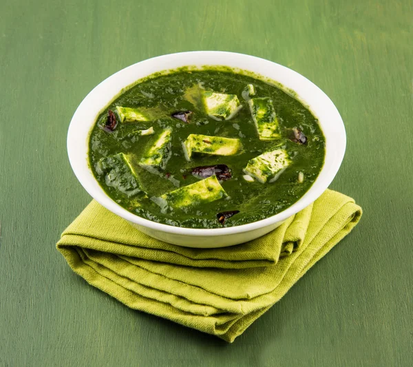 Palak Paneer , Indian food Spinach and Indian cottage cheese curry - Side dish for Rice and roti / chapati / indian bread / phulka / paratha , isolated