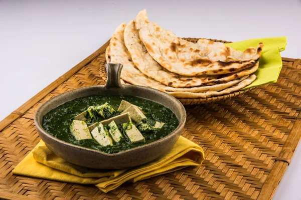 Palak paneer with indian bread or roti or chapati or naan