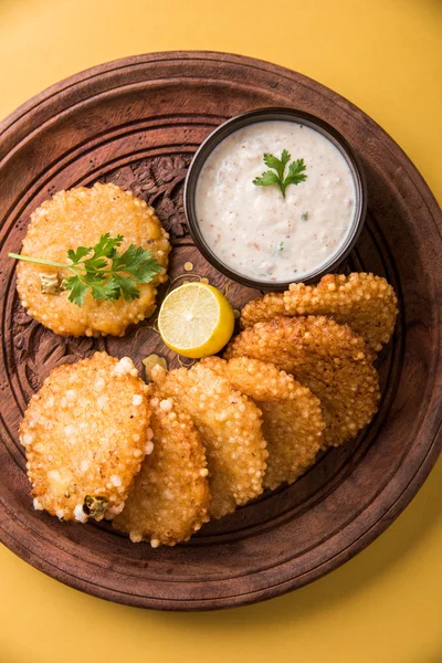 Tasty sabudana vada or sabudana vade made up of Sago served with peanut chutney, a famous fasting recipe or snack from maharashtra, India