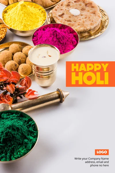 Happy holi greeting card, holi wishes, greeting card of indian festival of colours called holi, season\'s greetings, indian festival greeting, indian food & colours arranged on ground for holi greeting