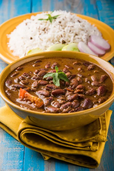 Cooked red kidney beans curry and cooked basmati rice, rajma chawal or rajma rice, traditional north indian lunch, dinner or breakfast menu