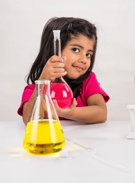 4 year old indian girl doing science experiment, science Education. asian kid and science experiment, chemistry experiment, indian girls and science experiments, indian girl and science